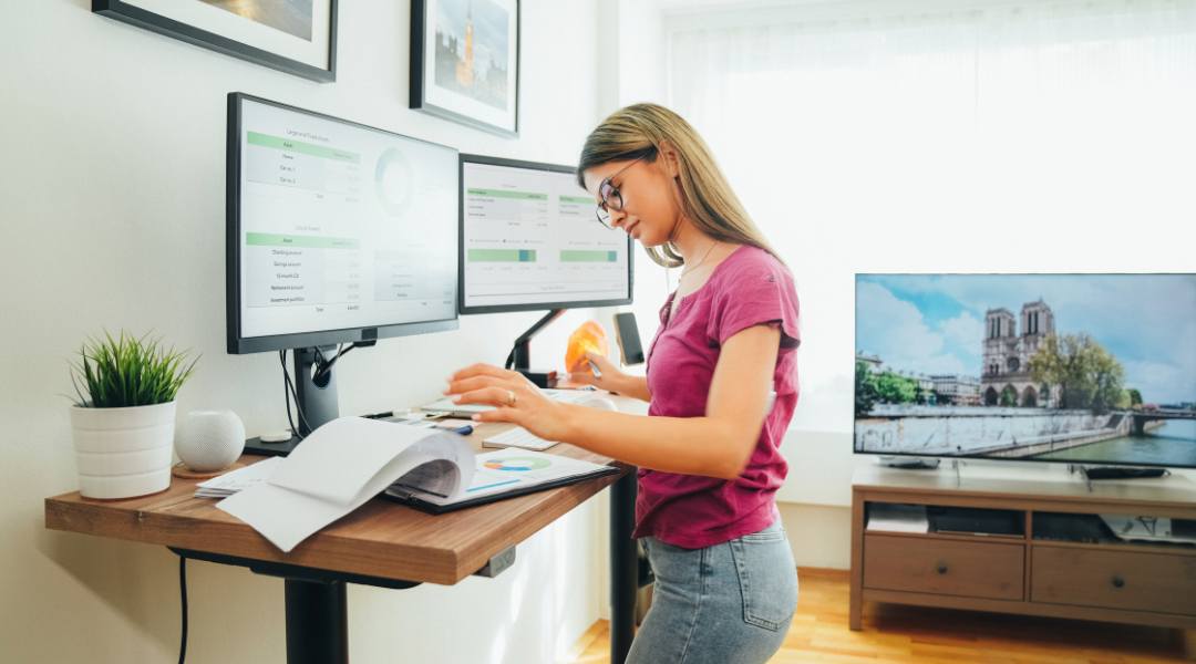 woman working productively at standup desk
